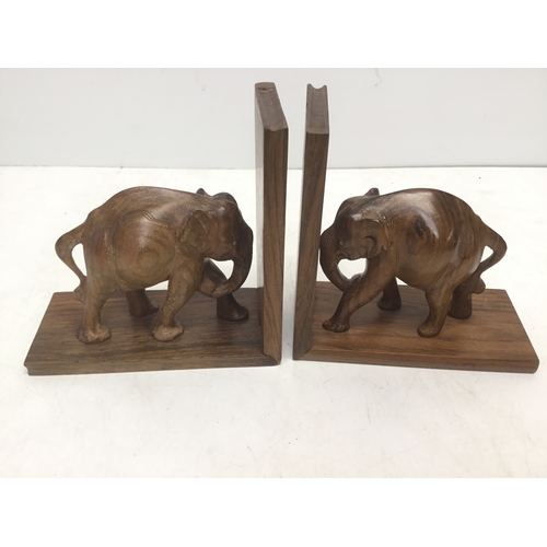 894 - A pair of carved wooden African elephant bookends