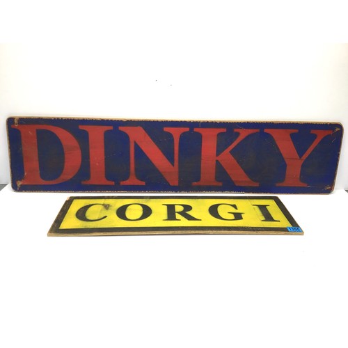 1355 - Two wooden display signs Corgi and Dinky, Dinky sign 112cm x 25cm