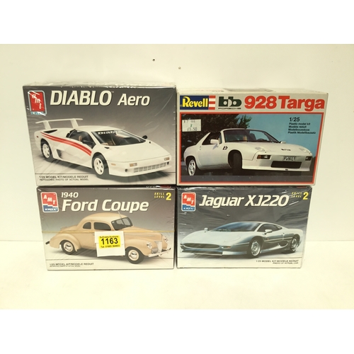 1163 - Four model car kits by Revell and AMT