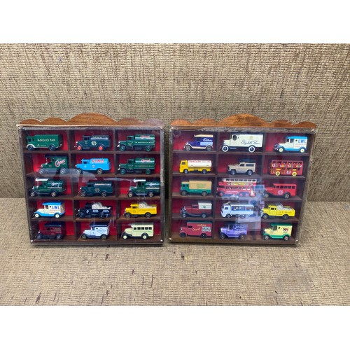 1312 - Selection of die cast vehicles in display cabinets.