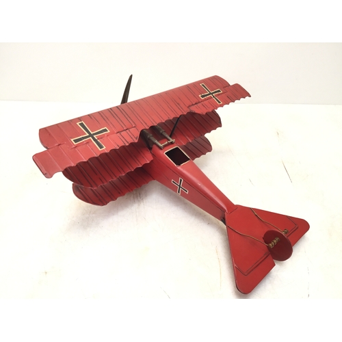 925 - Vintage Red Baron metal Tri plane with moving propellor
