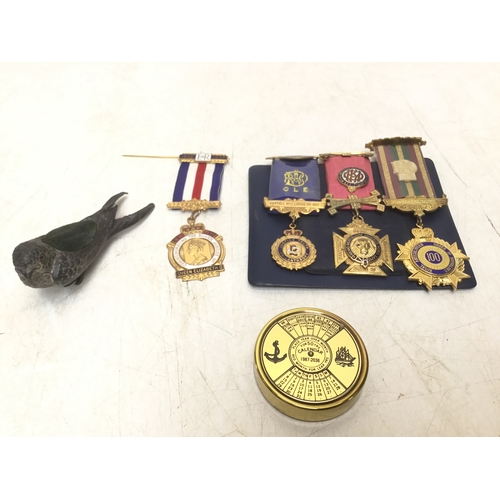 964 - Collectible items including Masonic medals, bird pin cushion and a brass 50 year calendar
