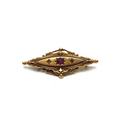 1238 - Stunning 15ct gold mourning art deco brooch with ruby encrusted into the centre.
