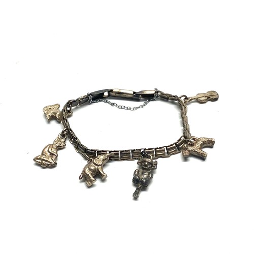 1030 - Silver Charm Bracelet with 6 charms.