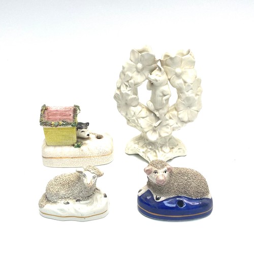 1042 - Collection of porcelain figures including: Staffshire 19th century Sheep and Double Bud Vase.