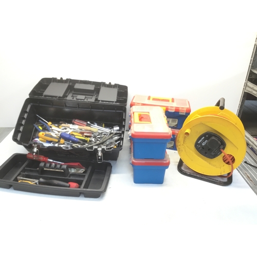 242 - A selection of tool boxes with some tools and extension leads