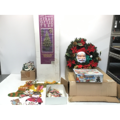 248 - Christmas ornaments including 120cm fibre optic tree, musical ice skaters and a Santa wreath