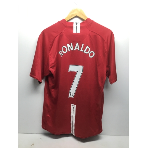 274 - Manchester United home shirt from 2007 season with Ronaldo to the rear and the iconic number 7 size ... 