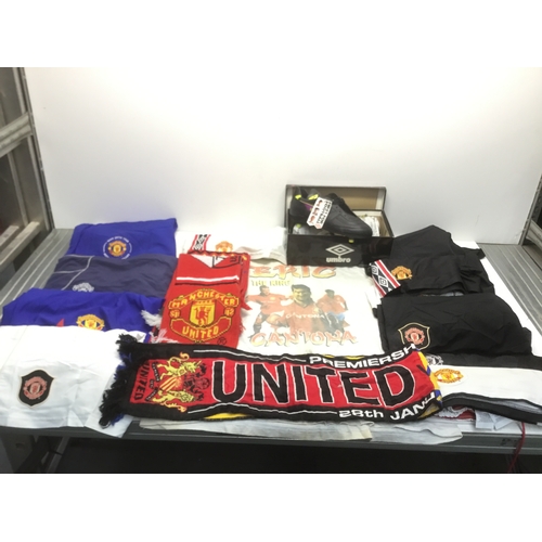 279 - A collection of Manchester United memorabilia including shorts, scarves, Cantona T Shirt and Umbro b... 