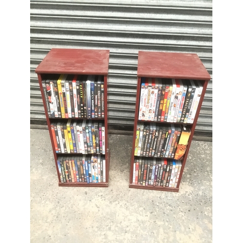 18 - A pair of storage units with spinning action full of mixed DVD’s