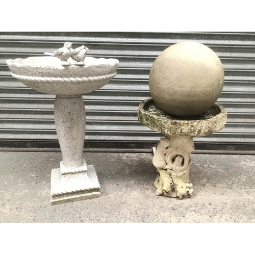 22 - Stone bird bath with ball decoration and a plastic bird bath