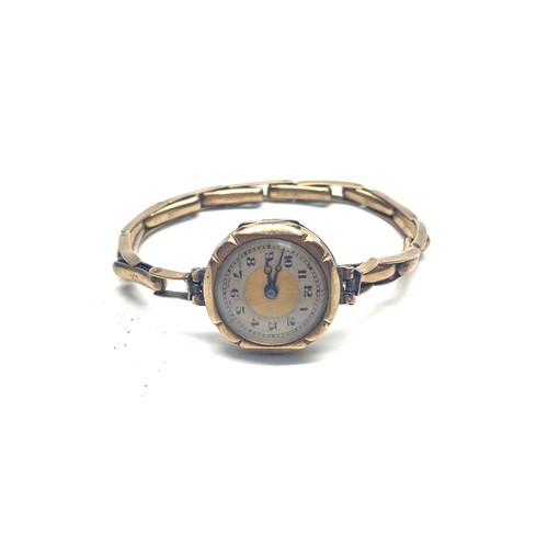 1185 - 9ct gold ladies' watch. The watch case and strap are both 9ct. Total weight 13.3g