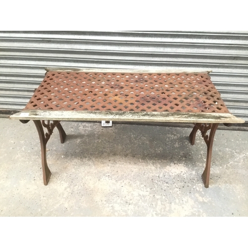 8 - Cast iron table with metal latticework top A/F 108cm x 57cm