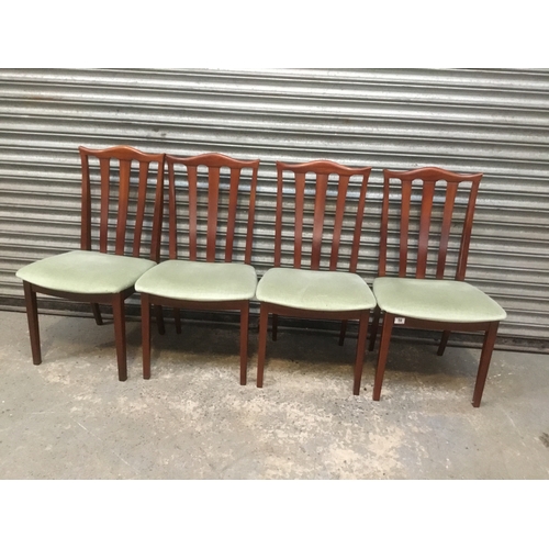 59 - Four G Plan dining chairs with green padded seats