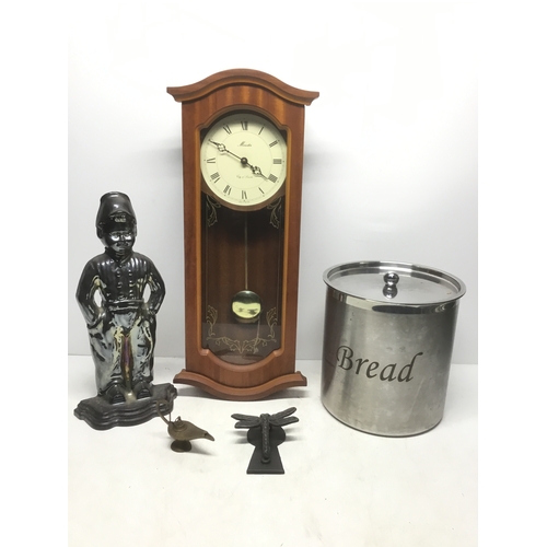 123 - Mixed items including metal bread bin, wall clock and a dragonfly door knocker