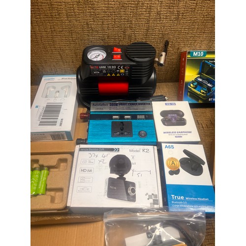 5 - Motopower MP69033 OBD2 Scanner, power inverter, batteries, and wireless headphones.