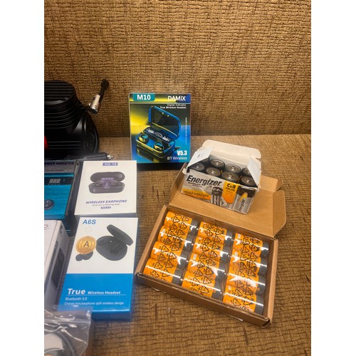 5 - Motopower MP69033 OBD2 Scanner, power inverter, batteries, and wireless headphones.