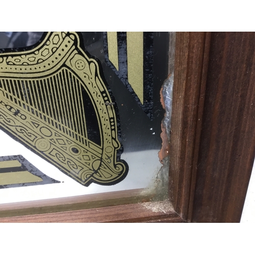 804 - Large Guinness gives you strength advertising mirror (back has been damp)