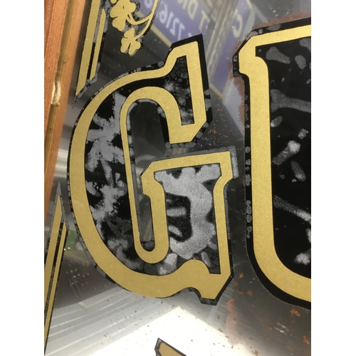 804 - Large Guinness gives you strength advertising mirror (back has been damp)
