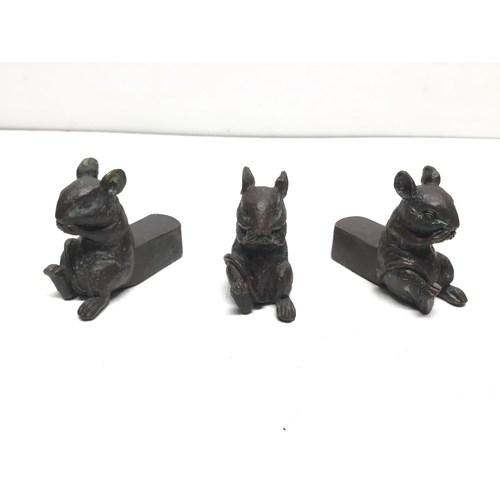 825 - Set of three clay bronze effect plant pot stands