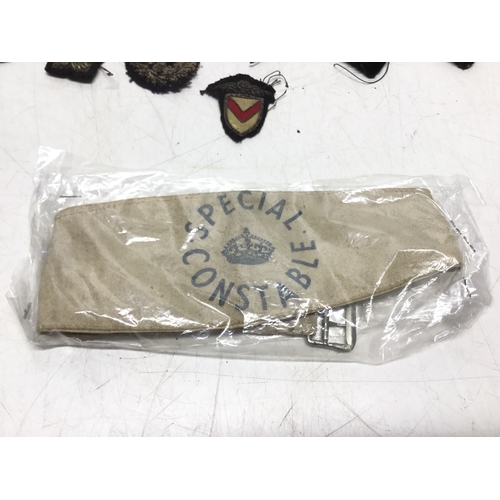 846 - A collection of police insignias including a Special Constable armband