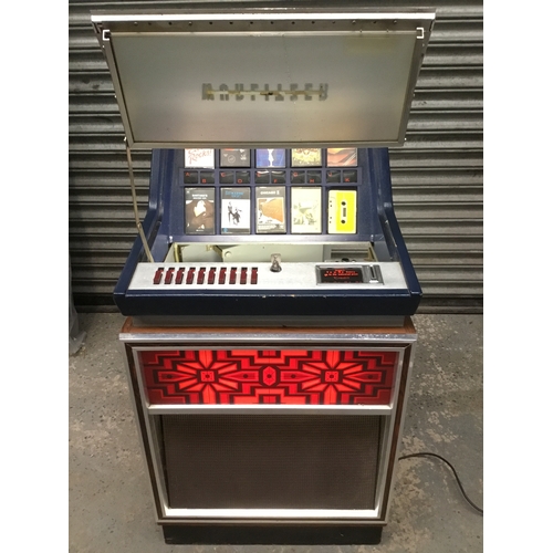1405A - Wurlitzer C110 Cassette Jukebox, Germany Circa 1970’s comes with tapes lights up and plays