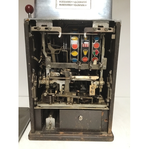 1405B - The Governor one armed bandit by Jennings with slot for 5p and featuring a brass Indian head chief o... 