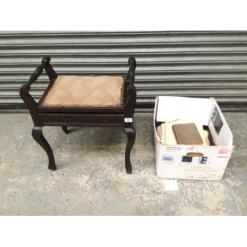 14 - A vintage piano stool with a large quantity of sheet music