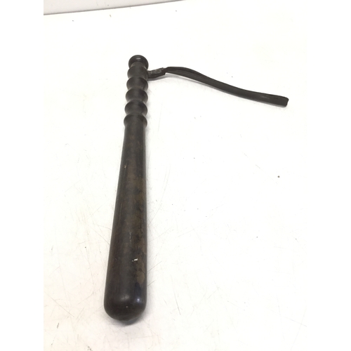 809 - Early twentieth century police truncheon with turned handle and leather strap