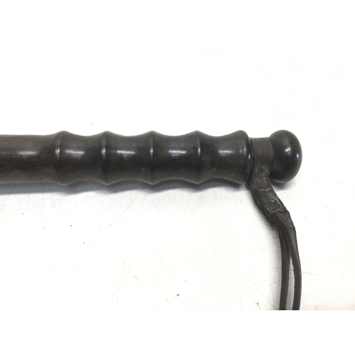 809 - Early twentieth century police truncheon with turned handle and leather strap