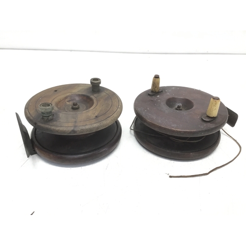 810 - Two vintage wooden and brass fly fishing reels