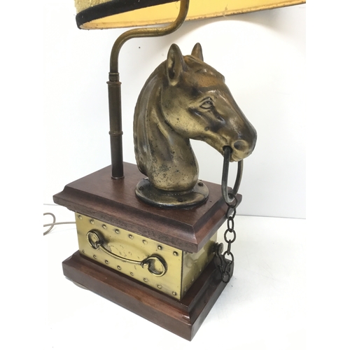 811 - Brass style horse head lamp on a wooden plinth with shade 78cm to top of shade