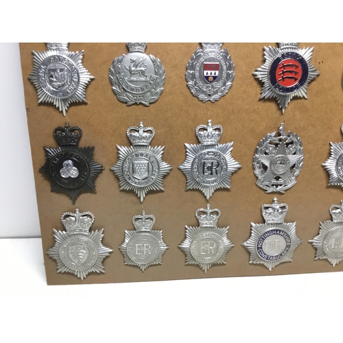 819 - A collection of 35 vintage police helmet badges including Merthyr Tydfil, Bristol and Leeds