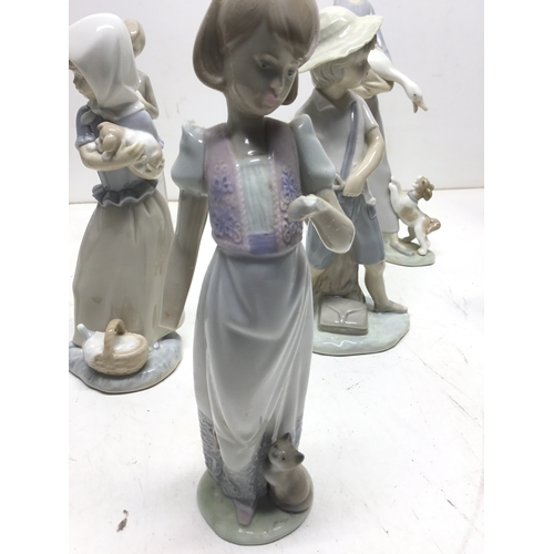 998 - A collection of Lladro and NAO (Lladro) figures plus two others