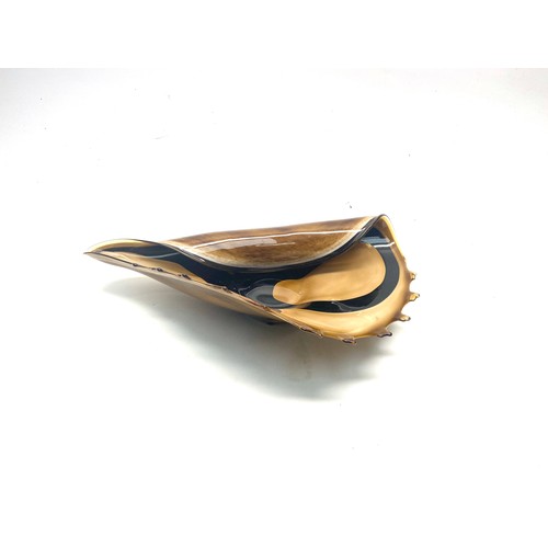 1034 - Murano-style handblown art glass conch shell bowl in amber, brown and black colours. 44cm.