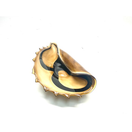 1034 - Murano-style handblown art glass conch shell bowl in amber, brown and black colours. 44cm.