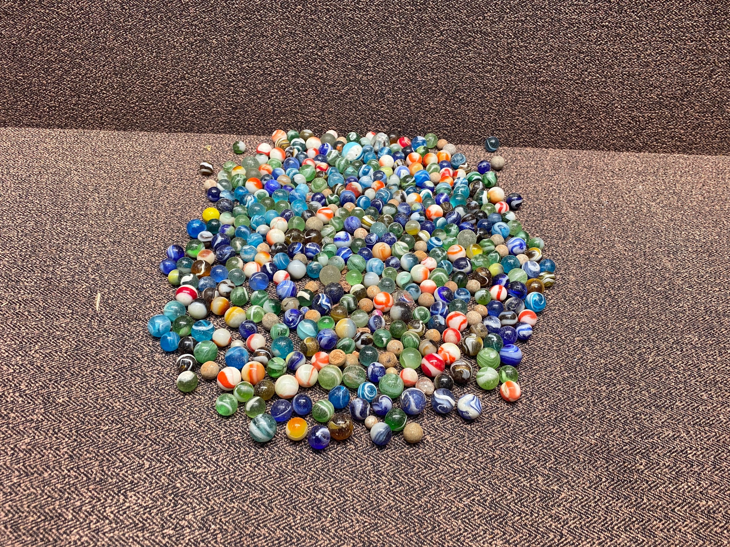 large collection of vintage and modern marbles.