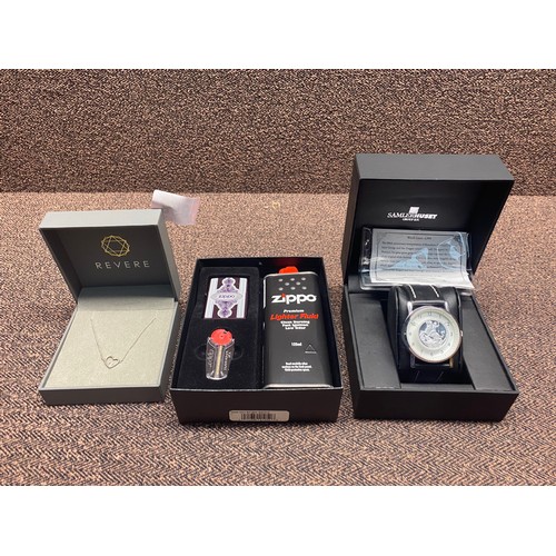 868 - London Samler Huset watch containing 2019 silver full sovereign, a revere silver necklace and a Zipp... 