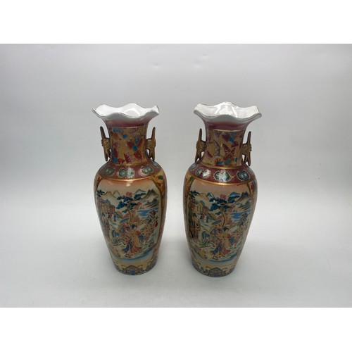 895 - A pair of Vintage Japanese satsuma vases featuring hand painted scenes and characteristics of the Me... 