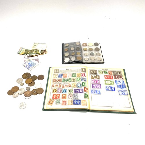 1021 - Collectible items, including World Coin Stock Full of Coins and The Victory Stamp Album with stamps.