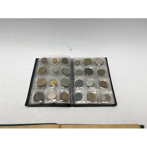 1021 - Collectible items, including World Coin Stock Full of Coins and The Victory Stamp Album with stamps.