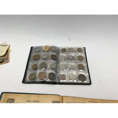 1021 - Collectible items, including World Coin Stock Full of Coins and The Victory Stamp Album with stamps.