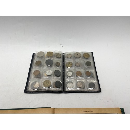 1021 - Collectible items, including World Coin Stock Full of Coins and The Victory Stamp Album with stamps.