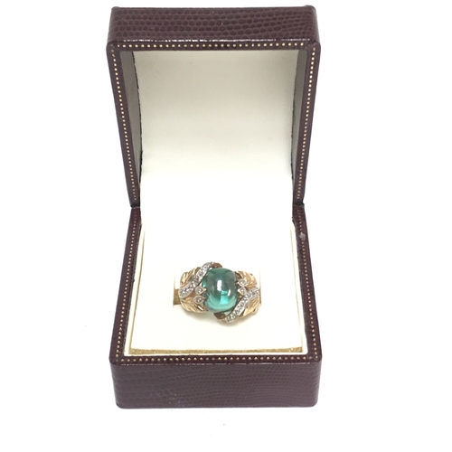 1281 - 9ct gold ring with Tourmaline central stone and diamond shoulders size N and 7.9g