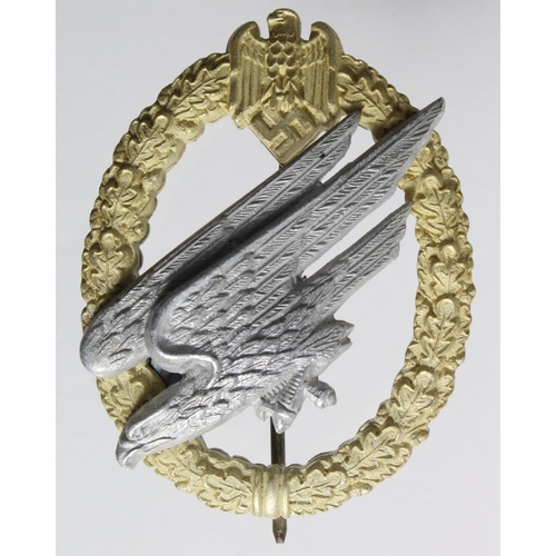 563 - German Nazi Army Para Badge in Aluminium, maker marked 'C E Juncker'.