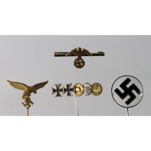 589 - German Nazi stickpins - one for the Luftwaffe, a Tank Corps medal group on pin, a Political Eagle pi... 