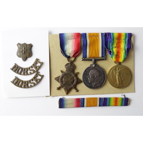 65 - 1915 Star Trio to 10077 Pte C J Nicholls Dorset Regt. With collar and titles. Entitled to the Silver... 