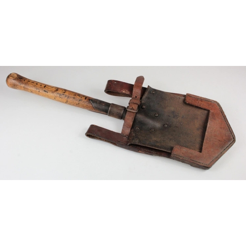 672 - German WW1 entrenching tool in its leather cradle