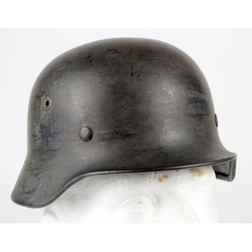 677 - German WW2 1935 pattern steel helmet nice example with original named lining