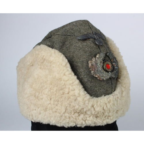 719 - German WW2 Winter Russian Front sheepskin cap, Officers badges but slightly loose good overall.